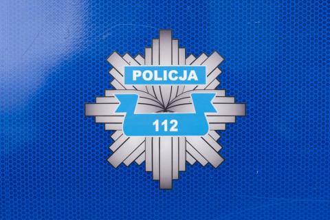 Logo w postaci gwiazdy z napisem policja i numerem 112 
